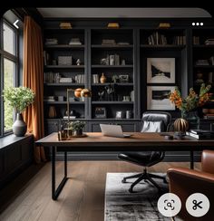 a home office with black bookcases, leather chairs and a large desk in front of a window