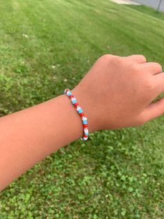 Glass bead bracelet, handmade with the colors red, white, and blue Patriotic Colorful Beads Bracelet For Gift, Patriotic Beaded Bracelets With Colorful Beads As Gift, Blue Beaded Patriotic Stretch Bracelet, Patriotic Red Beaded Bracelets With Round Beads, Patriotic Red Beaded Bracelet With Round Beads, Patriotic Blue Beaded Stretch Bracelet, Patriotic Red Beaded Bracelets, Patriotic Red Beaded Bracelet, Patriotic Red Beaded Bracelets As Gift