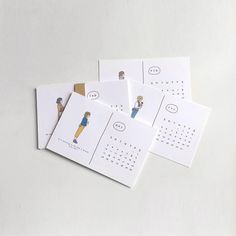 four calendars with cartoon characters on them sitting next to each other in front of a white background