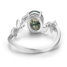 Break free from your thoughts and marvel at the beauty of our nature-inspired Between the Leaf Oval Moss Agate Leaf Ring©. The astonishing oval-shaped moss agate stone sits at the center of gracefully sculpted silver leaves with round white topaz gems for a hint of sparkle. Lay it like a miniature forest down your fingers and let its radiant energy keep you grounded. ✦ Available in both 14K white gold vermeil (14K white gold plated over a sterling silver base) and 10K solid white gold. Nature-inspired Oval Emerald Ring, Nature-inspired Oval Emerald Ring As Gift, Nature-inspired Moss Agate Round Rings, Nature-inspired Moss Agate Rings, Miniature Forest, Moss Agate Stone, Radiant Energy, Silver Leaves, Gold Vermeil Jewelry