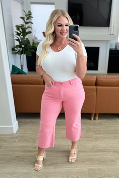 Slip into style and comfort with our Lisa High Rise Control Top Crop Jeans from Judy Blue. Featuring tummy control technology and 4-way stretch, these jeans provide a flattering fit. The wide leg crop and raw hem add trendy details, while the fun pink color will brighten up any outfit. Garment dyed for lasting color. Judy Blue High Rise Zip Fly Control Top Wide Leg Crop Silhouette Raw Hem 93% Cotton, 6% Polyester, 1% Spandex True to Judy Blue Sizing 0/24: Waist: 24" Hips: 32" Rise: 10.5" Inseam: Fly Control, Judy Blue Jeans, Top Crop, Crop Jeans, Hat Hairstyles, Cropped Jeans, Bottoms Pants, Long Tops, Dress Accessories