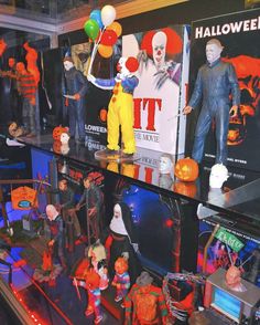 there are many halloween decorations on display in the store