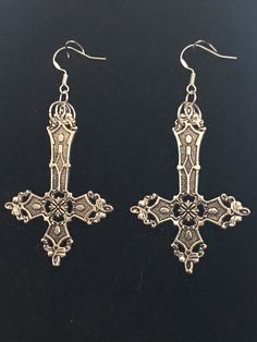 Large cross earrings  6cm x 4cm cross size With silver plated shepherds  Or choose sterling silver shepherds hook wires Nickel-free Metal Cross Earrings, Gothic Metal Plug Earrings With Ear Wire, Cross Shaped Metal Earrings For Pierced Ears, Gothic Metal Cross Jewelry, Gothic Cross Metal Jewelry, Medieval Cross Metal Jewelry, Gothic Silver Metal Plug Earrings, Gothic Nickel-free Cross Jewelry, Silver Metal Cross Pendant Earrings