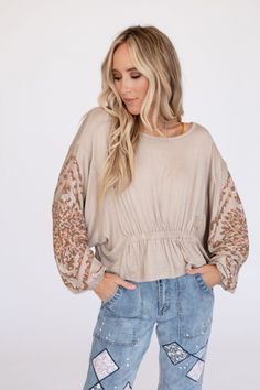 You need this Savannah Dolman Top, it's the ultimate addition to your boho wardrobe! Featured in a soft jersey knit fabric, a flattering shirred waistline, boho inspired print along the sleeves, and cute dolman sleeves with elastic wrist cuffs, it's sure to get compliments! Pair with cute pants like our Cher Solid Raw Edge Flare Pants for a comfy cute boho outfit. *Due to lighting and differences in monitors, actual colors may vary slightly from what appears online. Model is 5'8" and wearing a s Dolman Top Outfit, Boho Wardrobe, Boho Outfit, Dolman Top, Cute Pants, Cream Tops, Level 5, Wrist Cuffs, Jersey Knit Fabric