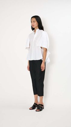 Noir kei ninomiya double sleeve blouse in white    the double sleeve blouse has a relaxed silhouette made of a cotton poplin. it features a classic collar button front draped short sleeves and draped sides.    material: 100% cotton    made in japan Noir Kei Ninomiya, Kei Ninomiya, Easy Tiger, Caged Sandals, Black Tank Dress, Black Aviators, Neon Purple, Boyfriend Tee, The Double