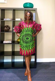 Bright and happy African dress!  Our lovely African print dress has a split neck, 2 side pockets, and an all-around flattering look for every size. XS-Plus sizes. Length-37" Model is 5'7" This dress will be hand crafted for you upon purchase.  *️⃣ FEATURES 🔸Beautiful peplum sleeves 🔸Split neck design 🔸Loose fit Colors: Pink and green  MEASUREMENT GUIDE:  We appreciate you including your bust and hip measurements if not we will use the measurements listed with the size selected. US "2" /UK "6" XXS Bust:31 Hips: 34 US "4"/ UK "8" XS - Bust:32 Hips: 36 US "6"/ UK "10" S - Bust:34 Hips: 38 US "8"/ UK "12" M - Bust:36 Hips: 40 US "10"/ UK "14" L- Bust: 38 Hip: 42 Other sizes sold out 📦 SHIPPING 🔸Processing the order- 1-7 days 🔸USPS First Class - 2-5 days 🔸Expedited shipping available at Green Printed Knee-length Dress, Green African Print Dress, Summer Dresses Green, Peplum Sleeves, Style Vert, Peplum Gown, Dress Stores, Ankara Clothing, Dress African Print