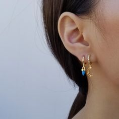 "Bring a little celestial whimsy to your look with the star (moon) charms dangling from these lobe-hugging loops of 16k gold plate. ♥ 16k gold plated over brass ♥ Diameter of hoop: outer - 12 mm / inner - 7.5 mm ♥ Measurement of pendants: star - 8 mm tall and width / moon - 9.5 mm tall and 7 mm width ♥ Sold as single (ONE earring) or a pair ♥ Latch back ♥ Nickel free ♥ All items are packed inside an elegant Gold Spoon jewelry box. If you are purchasing a product to send as a gift, we can send th Dainty Moon Shaped Single Earring, Dainty Single Moon Earring, Moon Charm Huggie Earrings, Dainty Hypoallergenic Moon-shaped Earrings, Dainty Moon-shaped Hypoallergenic Earrings, Dainty Moon Shaped Hypoallergenic Earrings, Dainty Hypoallergenic Moon Earrings, Celestial Dangle Huggie Earrings As Gift, Celestial Dangle Huggie Earrings For Gift