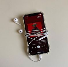 an iphone with ear buds connected to it