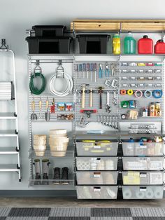 an organized garage storage area with lots of tools and supplies on the wall above it