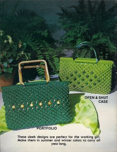 two green purses sitting next to each other on top of a white tablecloth