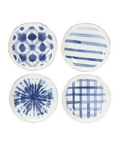 three plates with blue and white designs on them