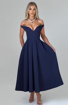 The epitome of elegance, Lanetta features a plunge bardot neckline with elasticated back strap bringing stylish flair. Falling to an effortlessly chic midi length, the design has a full, box pleated skirt and looks amazing paired with pointed heels and soft glam. 



Colour: Navy.

Premium non-stretch crepe.

Fully lined.

Plunge bardot neckline.

Shaped underbust seam.

Full, box pleated skirt.

Elasticated back strap.

Invisible zipper fastening.

Midi length.

 Size: XS, S, M, L, XL, XXL Box Pleated Skirt, Split Long Dress, Casual Sundress, Bardot Neckline, Box Pleat Skirt, Off Shoulder Dresses, Midi Dress Style, Maxi Dress Sale, Soft Glam