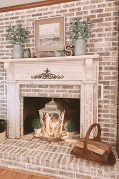 a fireplace with a lantern and some potted plants