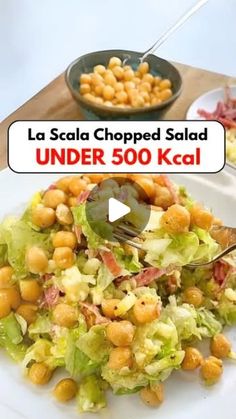 a salad with chickpeas and lettuce on it is being served in a bowl