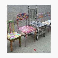 colorful chairs and tables are arranged in the shape of an intricately designed chair,