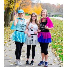 three girls in costumes posing for the camera