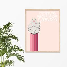 a star wars poster hanging on the wall next to a plant and potted plant