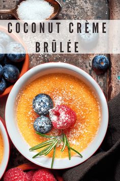 two bowls of coconut creme with berries and powdered sugar