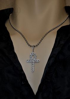 Embrace the symbolism of eternal life with our Egyptian Ankh Cross Pendant Necklace. This stunning pendant features the Ankh cross, beautifully adorned with sparkling stones, representing life and spirituality. Pendant Material: 925 Sterling Silver Chain Material: Stainless Steel Design: Egyptian Ankh cross with sparkling stones Features: Hypoallergenic, suitable for sensitive skin Perfect For: Daily wear, spiritual gatherings, special occasions, or as a thoughtful gift for men and women This Eg Spiritual Cross Jewelry In Metal, Symbolic Ankh Shaped Metal Jewelry, Symbolic Ankh-shaped Metal Jewelry, Symbolic Metal Cross Necklace, Nickel-free Ankh Elegant Jewelry, Nickel-free Ankh Jewelry, Nickel-free Ankh Shaped Elegant Jewelry, Elegant Nickel-free Ankh Jewelry, Spiritual Ankh Shaped Metal Jewelry