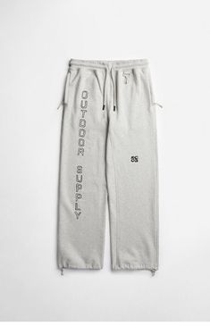 Upgrade your lounge game with the functional and comfortable Logo Sweatpants from RC Outdoor Supply. Featuring RCOS logo graphic down the left leg, these sweatpants come with zipper side hand pockets, elastic ankle cuffs, and an adjustable drawstring waistband for a custom fit.Solid color sweatpantsSoft fleece lining12" rise32.5" inseam20" leg openingDrawstring waistbandZipper side hand pocketsBack patch pocketElastic ankle cuffsRCOS graphics and embroiderySoft-touch coated metal signature hook Branded soft-touch toggle at leg openingTicked drawcord and pullers100% cottonHand washMeasurements taken from a size medium RC Outdoor Supply Mens Logo Sweatpants - Grey size XS Functional Cotton Sweatpants For Streetwear, Sporty Logo Sweatpants For Streetwear, Men’s Sweatpants, Sporty Cotton Sweatpants With Logo Detail, Relaxed Fit Pull-on Sweatpants For Streetwear, Mens Sweatpants, Mens Joggers, Drawstring Waistband, Men Winter