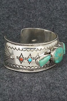 This stunning and substantial turquoise, coral and sterling silver bracelet was made by Navajo silversmith Emerson Delgarito. The inside is signed E. Delgarito and stamped sterling.Size: 5 3/8" (will fit up to a 6 1/2" wrist)Gap: 1 1/8"Length: 1 1/8"Free shipping on all orders! We ship with USPS and always include tracking. All orders ship within a day of payment.Returns are accepted up to 30 days after you receive your order. Just send us a message. Our shop offers cash back or store credit. Th Southwestern Multi-stone Bracelet Jewelry, Southwestern Silver Multi-stone Bracelet, Southwestern Silver Multi-stone Bracelets, Southwestern Silver Bracelet With Multi-stone, Native American Rings, Natural Stone Jewelry, Classic Jewelry, Coral Turquoise, American Jewelry