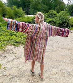 Introducing my latest creation! Upcycled two gorgeous rainbow crochet blankets into this cozy, one of a kind, technicolor dream coat. The main body features a thicker crochet material that is certain to keep you cozy during the chilly months! Perfect statement piece for breezy seaside mornings, late nights at festivals, dinner dates, or lounging around the house. This beauty is sure to turn heads wherever you may wander! Measurments: Overall length: 45" Chest: 46" Shoulder seam to wrist: 23" Model is 5'10 for reference. Machine wash, tumble dry on low heat. This statement jacket was made with all of my heart, for any human, anywhere, that may be attracted to its vibe! My intention is that the piece will amplify the divine nature of your inner being. ✨ Long Multicolor Hippie Outerwear, Hippie Multicolor Long Outerwear, Hippie Long Multicolor Outerwear, Colorful Cozy Outerwear For Spring, Multicolor Crochet Outerwear For Beach, Multicolor Crochet Beach Outerwear, Bohemian Multicolor Knit Outerwear, One Size Multicolor Crochet Outerwear, Bohemian Multicolor Crochet Outerwear