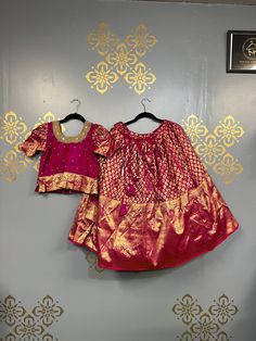 "Girls beautiful banarasi pattu pavda with handmade maggam work blouse Blouses come with extra 2\" room on both side, skirt has extra 4-5\" folded inside to open for future use Comes with hooks on backside of the blouse. All lehengas come with cancan attached with double lining  Girls size:8-10yrs Skirt length-31\" Chest-29\" Blouse length-17\" SIze:2yrs Lehenga length-27\" Chest-19\" Blouse length-11.5\" Please cross check measurements before placing the order Colors may vary slightly duo to ph Pink Anarkali Skirt Set For Diwali, Diwali Anarkali Pink Skirt Set, Pink Bollywood Skirt Set With Zari Work, Traditional Self Design Saree, Art Silk Choli With Tilla For Puja, Traditional Pink Skirt Set With Pallu, Pink Saree Skirt Set For Diwali, Fitted Pink Set For Puja, Art Silk Lehenga With Tilla For Puja