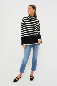 Moon River is an L.A.-based apparel company that makes easy, trendy pieces for day or night.You can never go wrong with a striped sweater, and this Black Striped Turtleneck Sweater by Moon River is our favorite. With a relaxed fit and black color block hem, this takes the classic style we all know and love and gives it a fresh look. The side slits and drop shoulders add fun details while still providing maximum comfort. Pair with denim and black flats for a casual but put-together look, or wear Fall Black Sweater With Striped Collar, Striped Turtleneck Sweater For Layering, Striped Relaxed Fit Sweater For Layering, Striped Sweater For Winter Loungewear, Casual Sweater With Contrast Stripes And Relaxed Fit, Striped Sweater For Fall Loungewear, Striped Relaxed Fit Sweater For Loungewear, Striped Turtleneck Sweater, Fall Denim