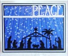 a nativity scene with the birth of jesus and baby jesus in silhouette on a blue background