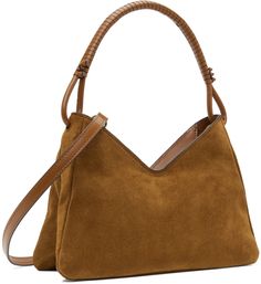 Suede shoulder bag in tan. · Hand-wrapped and knotted detailing at carry handle · Adjustable and detachable leather crossbody strap · Logo embossed at face · Zip closure · Patch pocket at interior · Moiré lining · Logo-engraved gold-tone hardware · H7 x W10 x D3 Supplier color: Tan Brown Hobo Bag With Rolled Top Handles, Brown Evening Bag With Rolled Handles, Chic Brown Satchel With Rolled Handles, Staud Leather Bags With Round Handle, Staud Rectangular Bag With Adjustable Strap, Staud Shoulder Bag With Leather Handles, Brown Crossbody Bag With Rolled Handles, Staud Shoulder Bag With Adjustable Strap, Staud Shoulder Bag With Leather Handles For Everyday