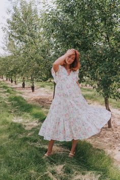 This flirty Take Me Back Dress is the perfect way to add some floral fun to your wardrobe. With a flattering V-neckline and playful ruffle details, you'll turn heads wherever you go. Don't miss out on this must-have piece. Details Floral pattern V-neckline Ruffle details Sizing Approximate measurements: SIZE LENGTH BUST Small 47" 38" Medium 48" 40" Large 49" 42" Fabric has no stretchModels are 5’10 wearing small Material 100% CottonHand wash coldHang to dry Ditsy Floral Print V-neck Dress For Garden Party, Flirty V-neck Midi Dress With Ruffle Hem, Feminine V-neck Dress With Ruffles And Short Sleeves, Summer V-neck Ruffle Dress For Brunch, Summer Floral V-neck Dress With Ruffles, Flirty V-neck Spring Dress, Spring Tiered V-neck Dress With Ruffles, Flirty V-neck Dress With Ditsy Floral Print, Spring Vacation V-neck Dress With Flutter Sleeves