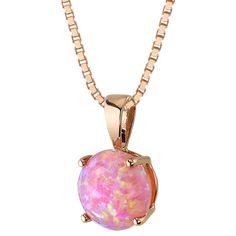 The color we've been dreaming of Do more than just gaze; allow yourself to be completely immersed in a new reality by our shimmering Pink Opals. This everyday luxury pendant features a round shape Peora created Pink Opal gemstone in 14K rose gold. Responsibly sourced in every sense, our created Pink Opal gemstones are physically, chemically, and optically identical to their natural counterparts. We're big fans of eco-luxury. Handcrafted in pure 14K rose gold goodness, this pendant has been carefully coated in an elegant rhodium finish. Our artisans are expertly trained in this process which fortifies the pendant's strength, shine and brilliance. Main Stone Lab Created Pink Opal 1 carat, round shape, 8 x 8 mm Pink iridescent hues Metal 14K Rose Gold 14K stamp, 0.5 grams Sizing Pendant measu Pink Opal Jewelry, October Birthstone Necklace, Opal Pendant Necklace, Rose Tone, Rose Gold Pendant, Rose Gold Pink, Pink Gemstones, Opal Pendants, Pink Opal