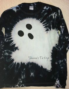 a black and white tie - dye shirt with buttons on it