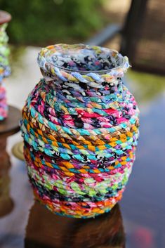 a multicolored vase sitting on top of a table