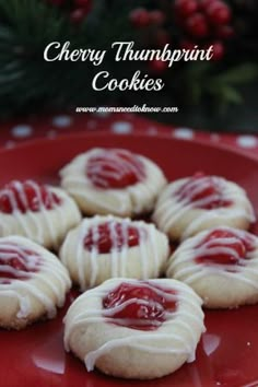 white chocolate covered cookies with red glaze on top and text overlay that reads cherry thumbprint cookies perfect for any holiday