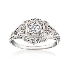 Ross-Simons - C. 1980 Vintage .35ct Diamond Filigree Ring Round Cut in 18kt White Gold. Size 7. C. 1980. Mark your engagement with a romantic vintage treasure! Brimming with filigree openwork, our elegant Estate collection ring boasts a beautiful .35 carat round brilliant-cut diamond in polished 18kt white gold. 3/8" wide. Diamond ring. Exclusive, one-of-a-kind Estate Jewelry. Diamond birthstones are the perfect gift for April birthdays. Elegant Formal Cluster Ring With Intricate Design, Timeless Hallmarked Platinum Diamond Ring, Timeless Platinum Hallmarked Diamond Ring, Timeless Hallmarked Diamond Ring For Wedding, Classic Filigree Ring With 17 Jewels For Wedding, Timeless Hallmarked Diamond Wedding Ring, Timeless Jewelry With Intricate Design For Anniversary, Timeless Intricate Jewelry For Anniversary, Vintage Diamond White Diamond Ring For Formal Occasions