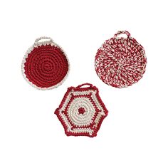 three crocheted coasters with handles on white background