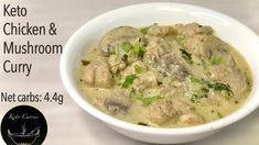 a white bowl filled with chicken and mushroom curry on top of a table next to a sign that says keto chicken & mushroom curry