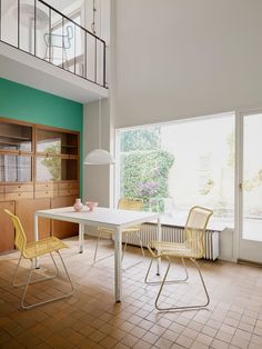 an empty room with two chairs and a table