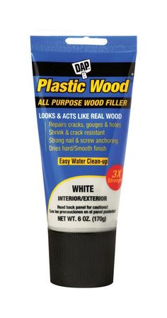 a tube of plastic wood filler on a white background