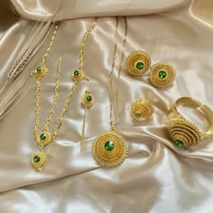 A classic set throughout Habesha culture and worn by women for weddings, baptisms, graduation ceremonies, religious holidays, and many other special occasions. This Eden Werki Set is perfect to wear as a complete set or worn individually to accentuate your habesha kemis for any special occasion. *Please email MyMeskel@gmail.com to order multiple sets for bridal parties All Gold Plated Jewelry 6-piece set includes: Necklace, earrings, ring, bracelet, headpiece, and hair pin Pendant Size: 4.5cm (1 Eritrean Gold Jewelry, Ethiopian Headpiece, Eritrean Braids, Habesha Culture, Arab Jewelry, Ethiopian Wedding, Ethiopian Jewelry, Ethiopian Dress, Habesha Kemis