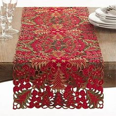 a red table runner on top of a wooden table