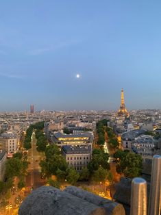 the eiffel tower towering over the city of paris, france at night time