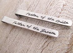 "Father of the Bride Gift - Father of the Groom Gift - Set of 2 Tie clips - A set of two aluminum tie clips, one stamped \"Father of the Bride\" , the other stamped \"Father of the Groom\". Stamped in the Elena Font. Tie clips measure about 1/4\" x 2.5\". They are given a brushed finish. As with all hand stamped jewelry, each piece is made just for you, so there may be slight differences. This is not to be seen as a defect, but as part of the character of the piece. Thank you for your understand Father Of The Bride Attire, Groom Tie, Bride Attire, Father Of The Groom