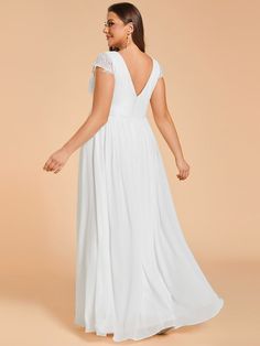 This chiffon wedding dress features a flattering V-neckline and delicate short sleeves, adding a touch of elegance to its ethereal charm. The front pleating accentuates the bodice, creating a timeless and sophisticated look that is perfect for any bride seeking grace and allure on her special day. Fit: Please refer to size chart. Length: Floor length. Sleeve Style: Sleeveless. Closure: It is concealed a zipper up the back. Undergarments: It is padded, with lining. Fabric:The garment comprises ch Infinity Gown, Chiffon Wedding Dresses, Neck Wedding Dress, Plus Size Wedding Gowns, Wedding Gowns With Sleeves, Simple Wedding Dress, Chiffon Wedding Dress, Wedding Dress Chiffon, Wedding Dresses For Sale