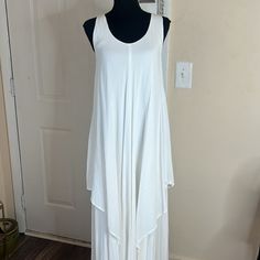 Aakasha White Lagenlook Sleeveless Layered Midi A-Line Dress Size S Oversized Nwt A-Line Silhouette Sleeveless Layered, Shark Bite Hemline Pullover Construction Approx. 46" From Shoulder To Center Front Bottom, 49" From Shoulder To Side Drape Bottom Cotton Hand Wash Bohemian Sleeveless Dress For Layering, White Bohemian Sleeveless Maxi Dress, Flowy Sleeveless Dress For Layering, Chic Drapey Sleeveless Dress, Chic Sleeveless Drapey Dress, White Flowy Rayon Maxi Dress, Bohemian Summer Dresses For Layering, Flowy Sleeveless Lagenlook Dress, Summer Bohemian Dresses For Layering