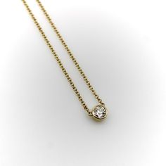 This 14k gold diamond necklace is a classic everyday piece and a great staple for any jewelry collection. The Old European Cut diamond has a lot of sparkle—its facets create excellent light play that pops when worn. The bezel setting is simple and the width of the chain balances the diamond well. This is a vintage piece, circa 1990’s, that contains a much older antique diamond. The perfect combination of old and new.  The natural antique diamond is Old European Cut, VS2 in clarity and I-J in col Luxury Necklaces With Single Diamond, Luxury Everyday Necklace With Single Diamond, Luxury Everyday Single Diamond Necklace, Timeless Everyday Diamond Necklace With Bezel Setting, Everyday Diamond Necklace With Round Cut, Classic Everyday Diamond Necklace With Accents, Classic Diamond Birthstone Necklace With Bezel Setting, Timeless 14k Gold Necklace With Bezel Setting, Gold Diamond Necklace With Bezel Setting For Everyday