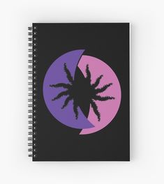 a spiral notebook with an image of a palm tree on the left and a half moon on the right