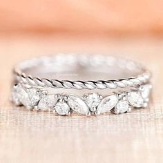 two wedding bands with diamonds on them