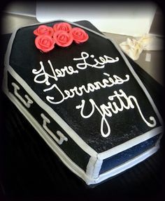 a black and white cake with red roses on it's side that says, we are special anniversary party